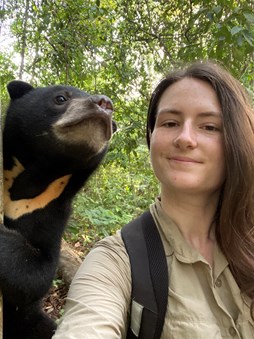 Kristen taking a selfie with a sunbear